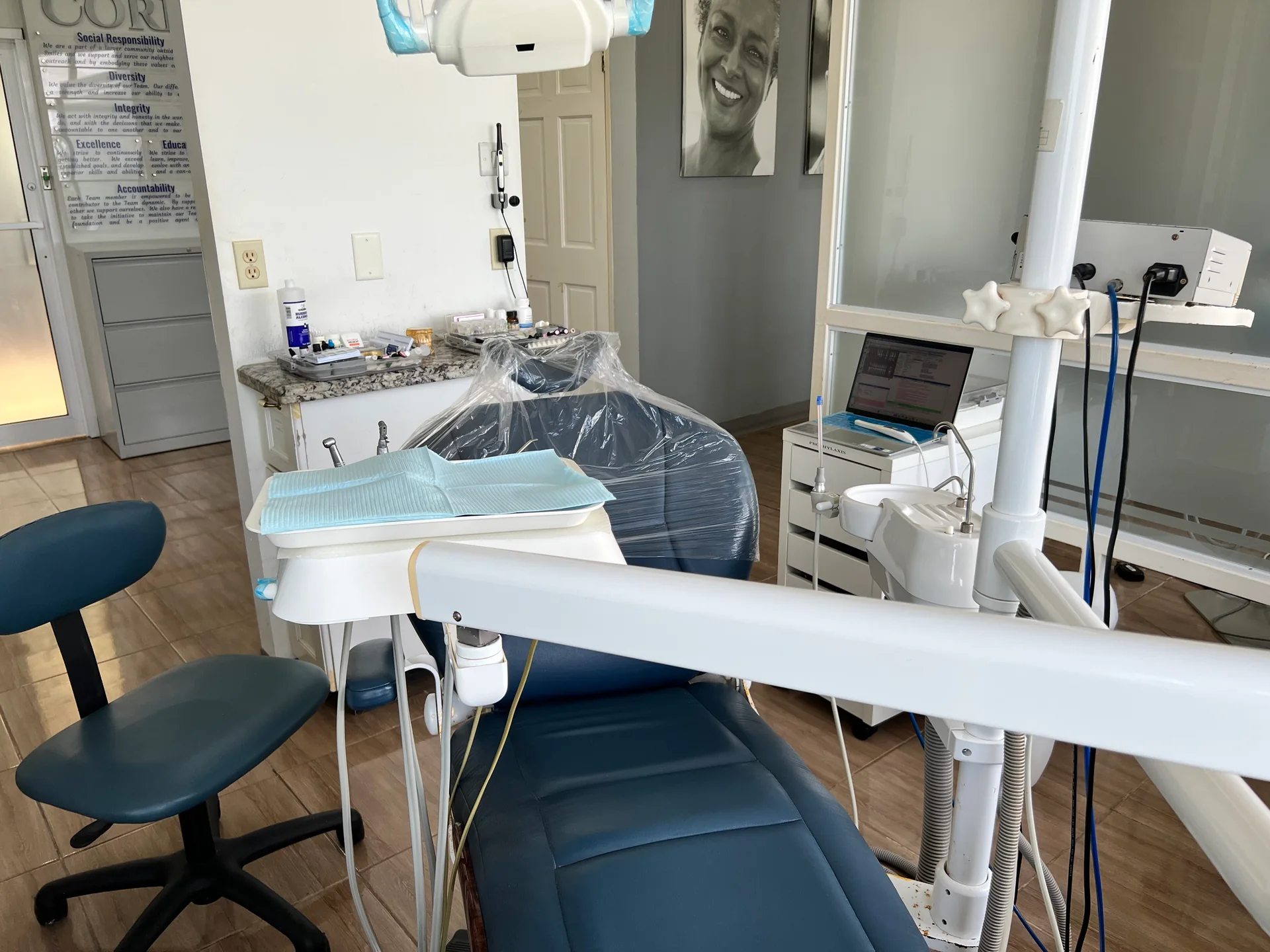 A close view of an Elite Smiles dental chair and treatment equipment